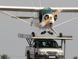 Piper Cub lands on top of truck