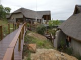 Main lodge is connected to the chalets by a deck pathway